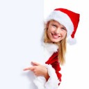 Isolated young christmas woman pointing at a blank board